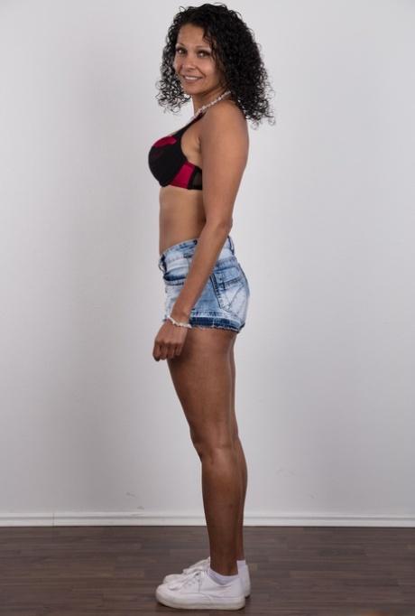 Latina female takes off her clothes to earn enough money for a flight home