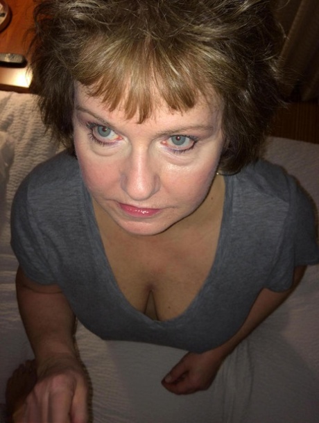 Plump older woman Bustybliss uncovers her large tits before a POV blowjob