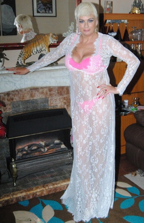 Older platinum blonde Dimonty models by herself after a lesbian kiss