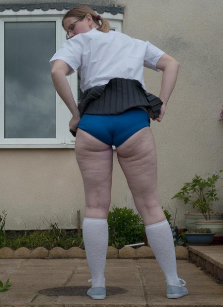 Fat older woman Sammie Slut frees her tits and twat from schoolgirl clothes