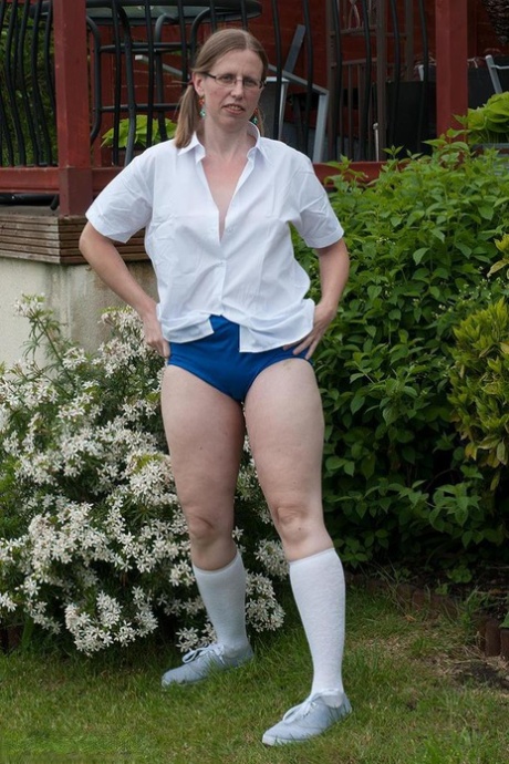 Fat older woman Sammie Slut frees her tits and twat from schoolgirl clothes