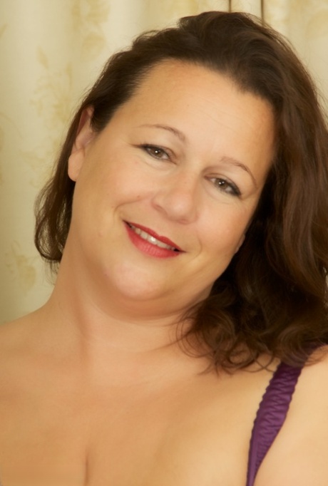Older BBW frees huge boobs from lingerie before pussy play in sheer nylons