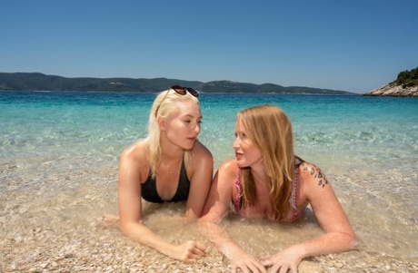 Older and younger women discover the joys of lesbian sex during a beach trip
