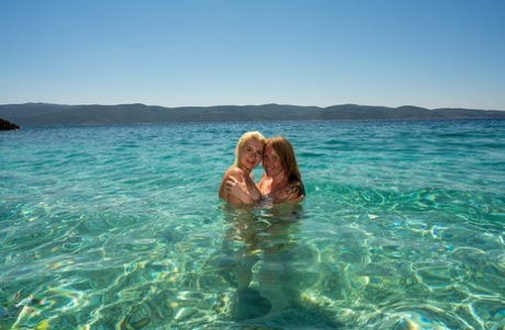 Older and younger women discover the joys of lesbian sex during a beach trip