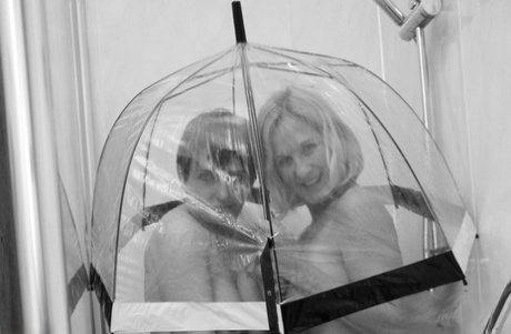 Molly MILF and her lesbian lover remove rain wear before showering