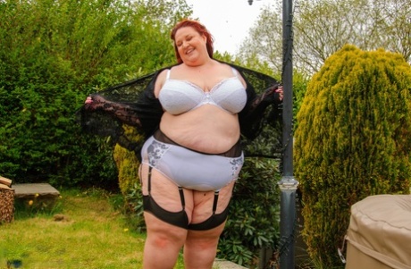 Morbidly obese older redhead dildos her snatch in a garter belt and nylons