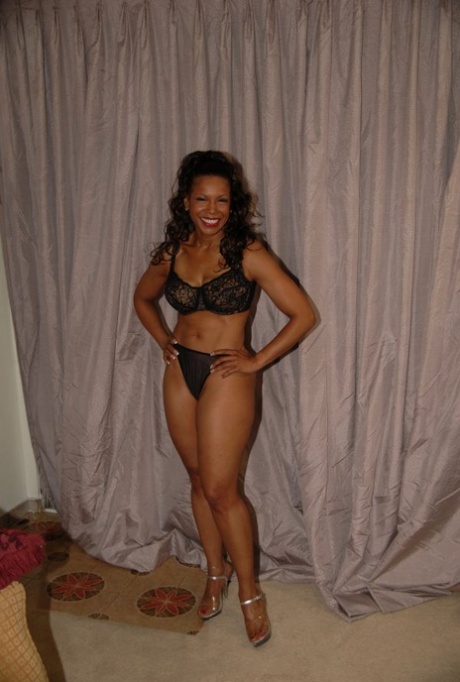 Hot mature Semmie Desoura denudes tits and rubs black pussy through panties