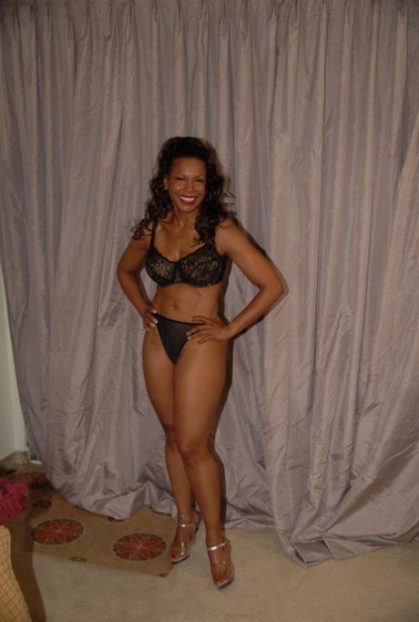 Hot mature Semmie Desoura denudes tits and rubs black pussy through panties