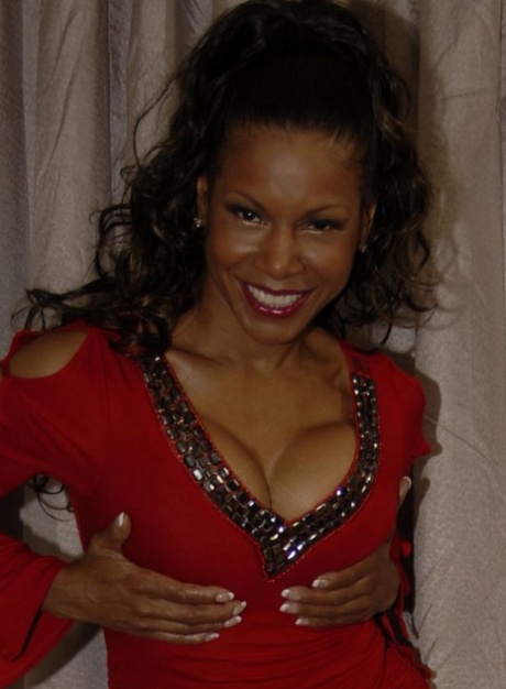 Hot mature Semmie Desoura denudes tits and rubs black pussy through panties