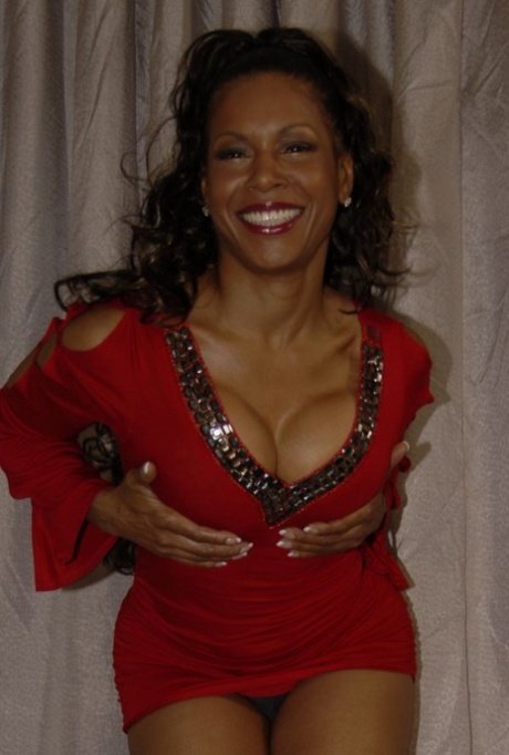 Hot mature Semmie Desoura denudes tits and rubs black pussy through panties