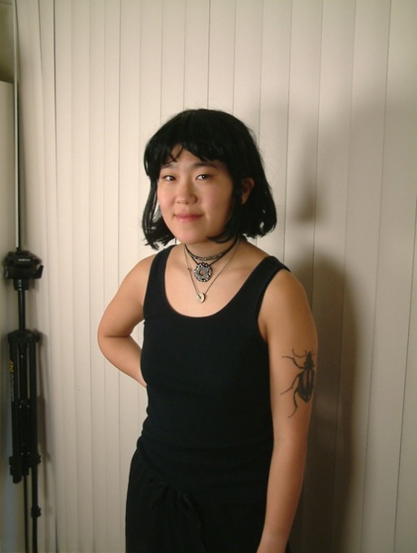 Slender amateur Asian Cady puts her hairy coochie under scrutiny