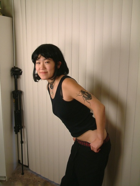 Slender amateur Asian Cady puts her hairy coochie under scrutiny