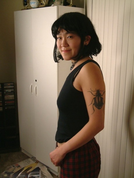 Slender amateur Asian Cady puts her hairy coochie under scrutiny