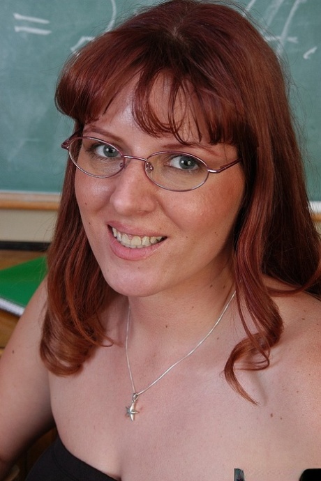 Mature schoolteacher Tru exposing large natural tits in classroom