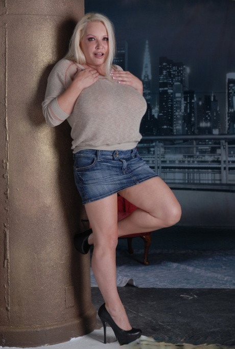 Blonde cougar Rachel Love exposes her tremendous breasts and flaunts them