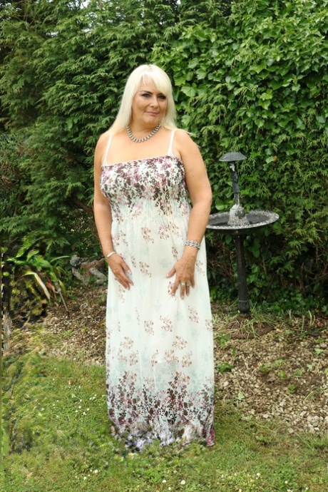 Blonde BBW Christina unleashes her big boobs and rubs her coochie