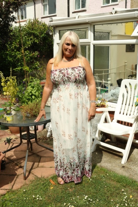 Blonde BBW Christina unleashes her big boobs and rubs her coochie