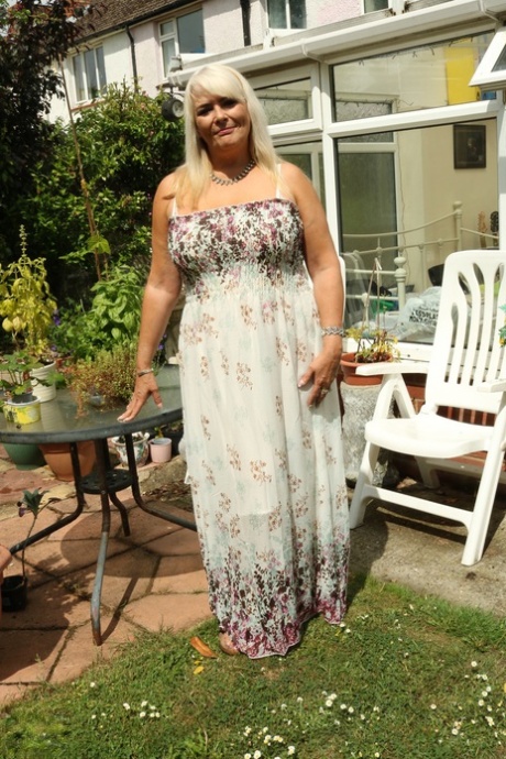 Blonde BBW Christina unleashes her big boobs and rubs her coochie