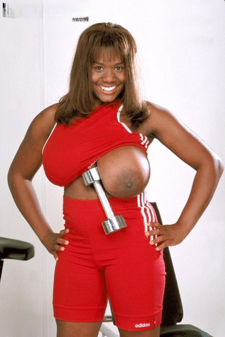 Black fitness fanatic Sammie Black unleashes her hooters as she strips at gym