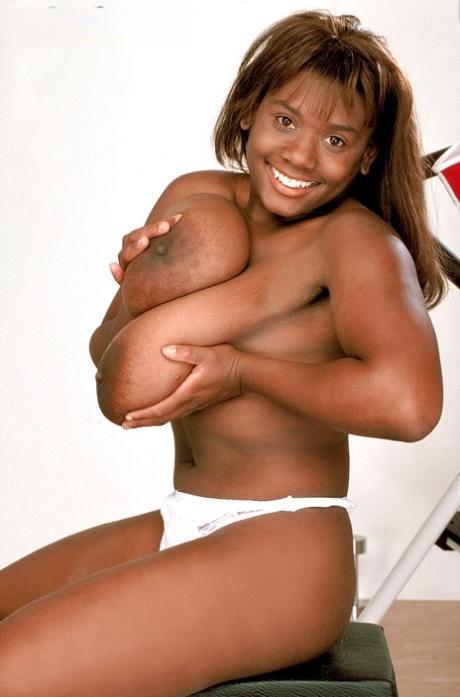 Black fitness fanatic Sammie Black unleashes her hooters as she strips at gym