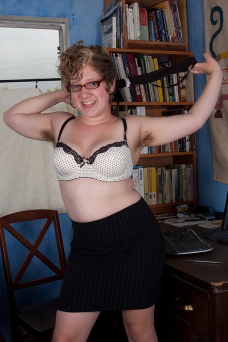 Chubby chick with natural juggs Josey reveals her hairy twat on a desk