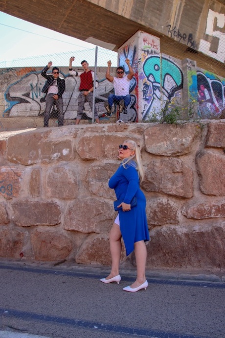 Fat blonde MILF Musa Libertina exposes her big tits and gets gangbanged