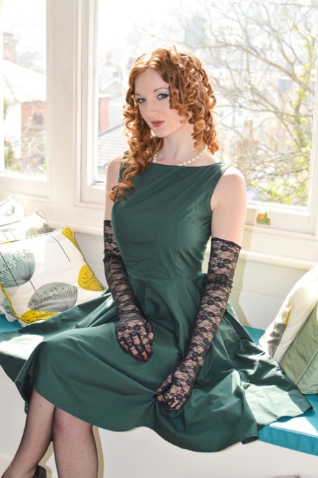 Stylish British lady and curly-haired girlfriend in stockings flash pussies
