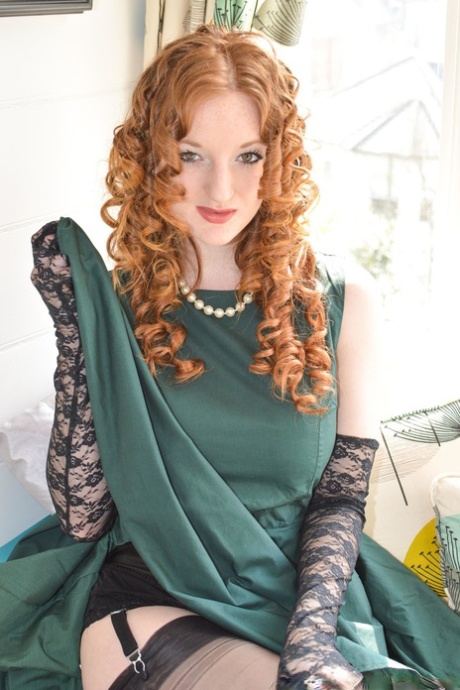 Stylish British lady and curly-haired girlfriend in stockings flash pussies