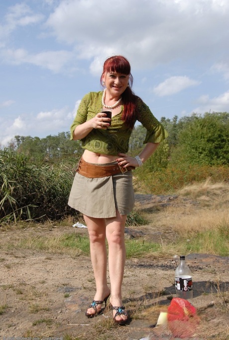 Ginger lady Esmeralda takes a piss outdoors and poses pantyless