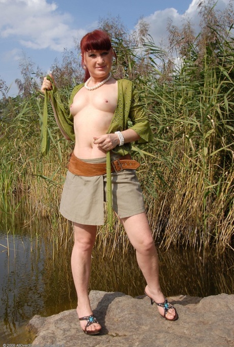 Ginger lady Esmeralda takes a piss outdoors and poses pantyless