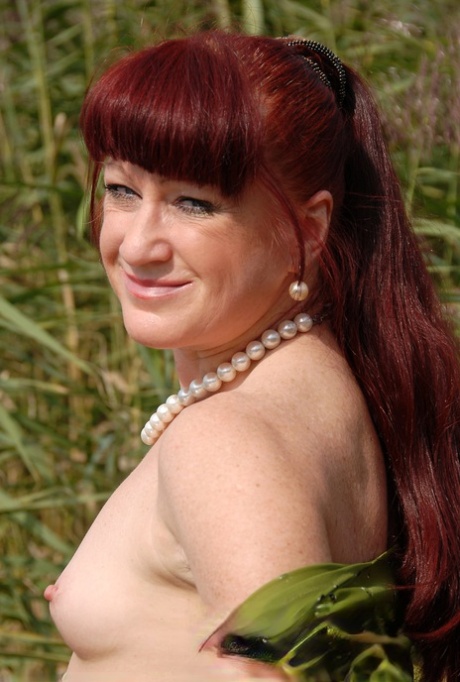 Ginger lady Esmeralda takes a piss outdoors and poses pantyless