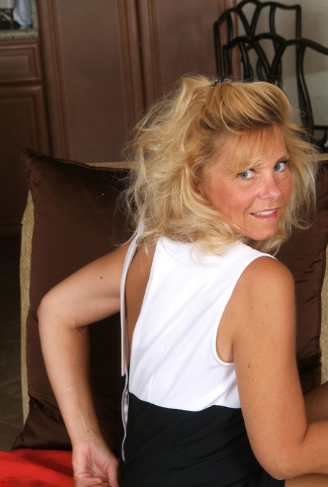 Blonde mature amateur Cricket unveils her saggy tits and teases with her feet