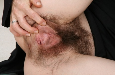 Mature nun Lacy gets rid of her habit and spreads her super hairy pussy