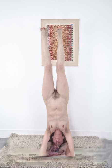 Fit mature lady Alexia Allen strips stretches, strips & spreads her hairy muff
