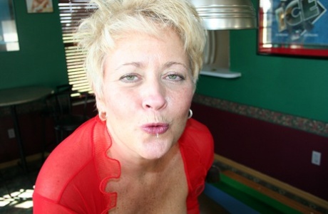 Amateur swinger Tracy Lick exposes her big tits and plays with a black cock