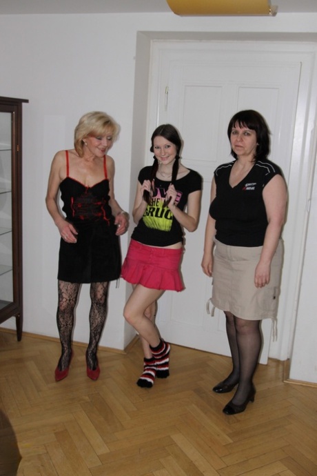 Two moms and one teen strip, cuddle and toy each other with a strapon