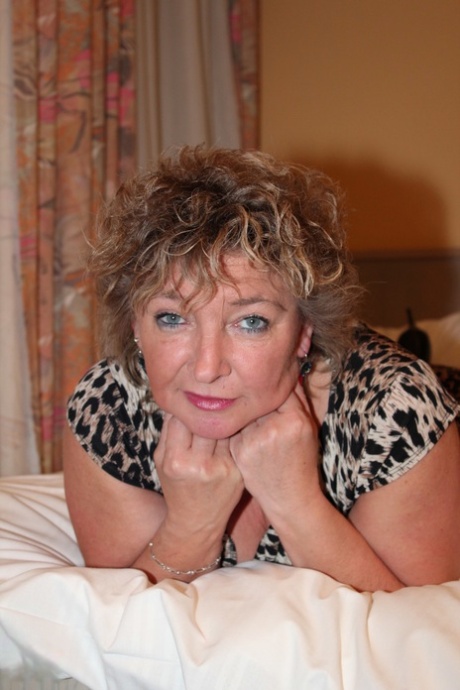 Mature European Nancy Q goes to her room and toys her tasty shaved pussy