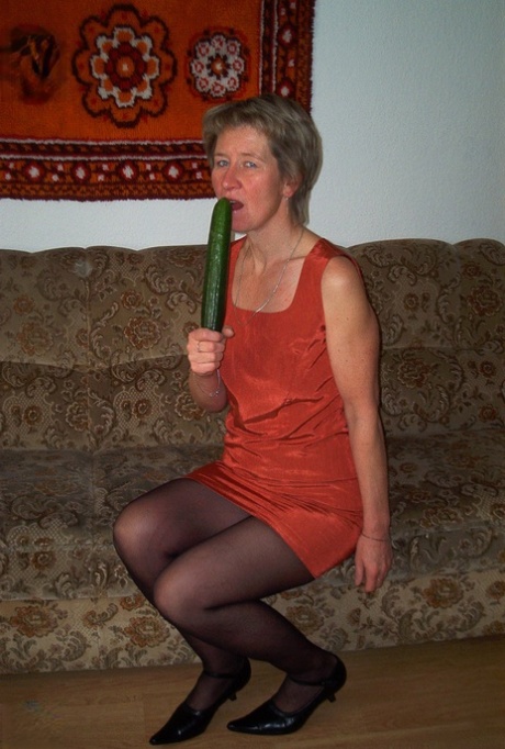 Housewife Christina toying her horny pussy with a cucumber & pissing in a bowl