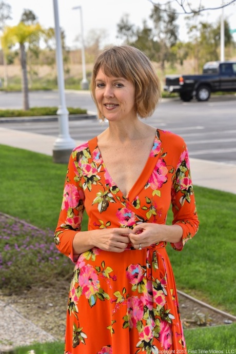 Mature wife Jamie reveals her boobs and flaunts her shaved cunt in public