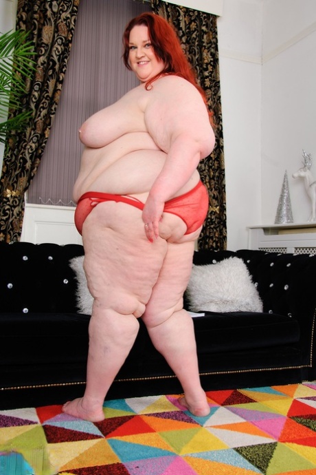 Mature redheaded SSBBW Missy reveals her big tits and masturbates in a solo
